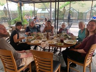 Dinner in Boulder with Rocky Mountain Peace & Justice Center—from left, Chris Allred, Giselle Herzfeld, Kristin from PeaceWorks KC, Usama Khalid, Betty Ball, Judith Mohling, Claire O’Brien.—Photo by Ann Suellentrop