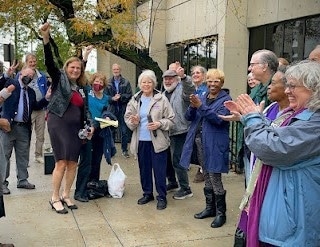 Ann Suellentrop cheers after her trial Oct. 25, and her supporters celebrate.--Photos by Kriss Avery
