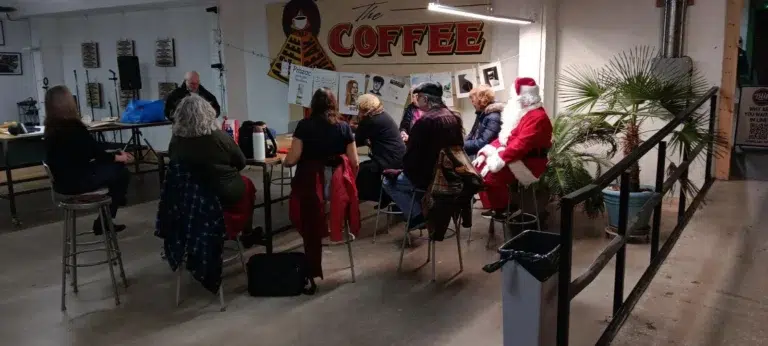 Santa and artists at coffee shop